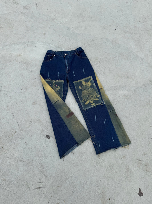 BuyMoor Essential denim jean Street Luxury Edition this is a unique 1 of 1 pair of upcycled denim jeans with decorative patches featuring ornate designs.
