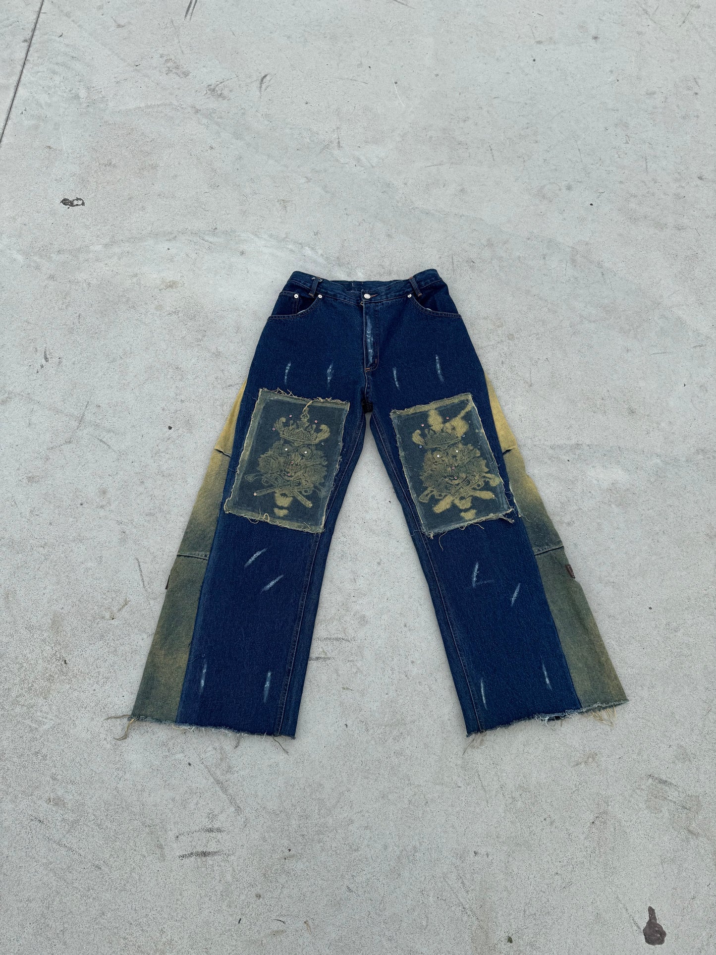 BuyMoor Essential denim jean Street Luxury Edition this is a unique 1 of 1 pair of upcycled denim jeans with decorative patches featuring ornate designs.
