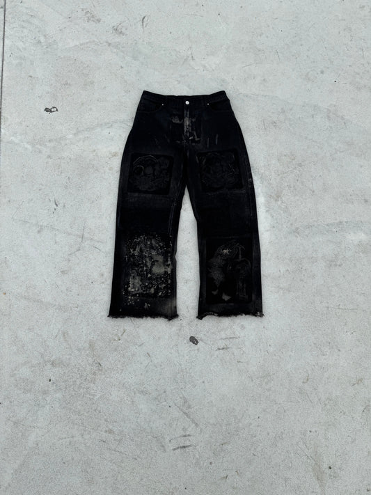 BuyMoor Essential denim jean Street Luxury Edition this is a unique 1 of 1 pair of upcycled denim jeans with decorative patches featuring ornate designs.